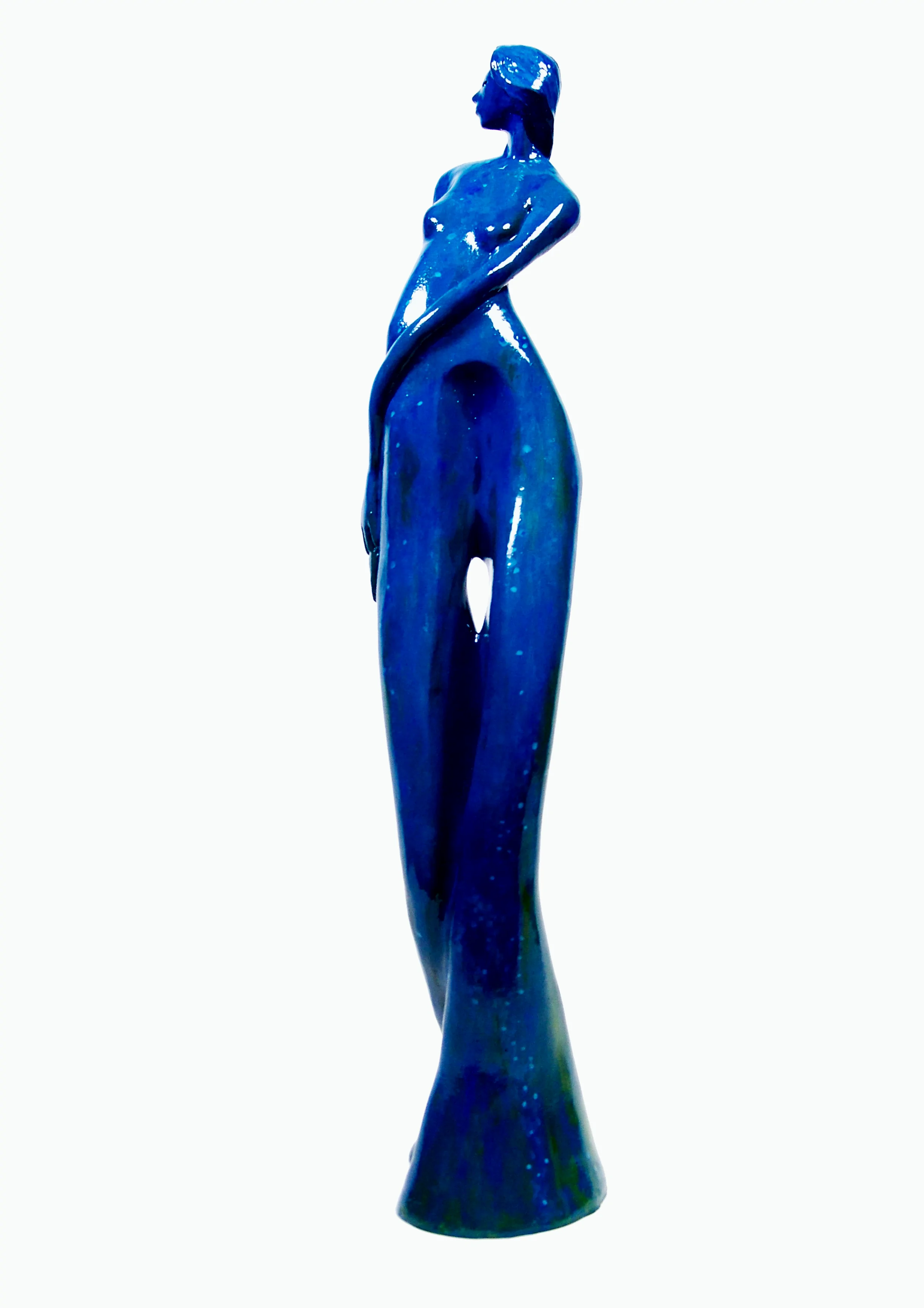 Mujer mirando hacia un lado con las manos en la cadera. Tonos azules y verdes. 42x9x9 centímetros, 1,370 kilos